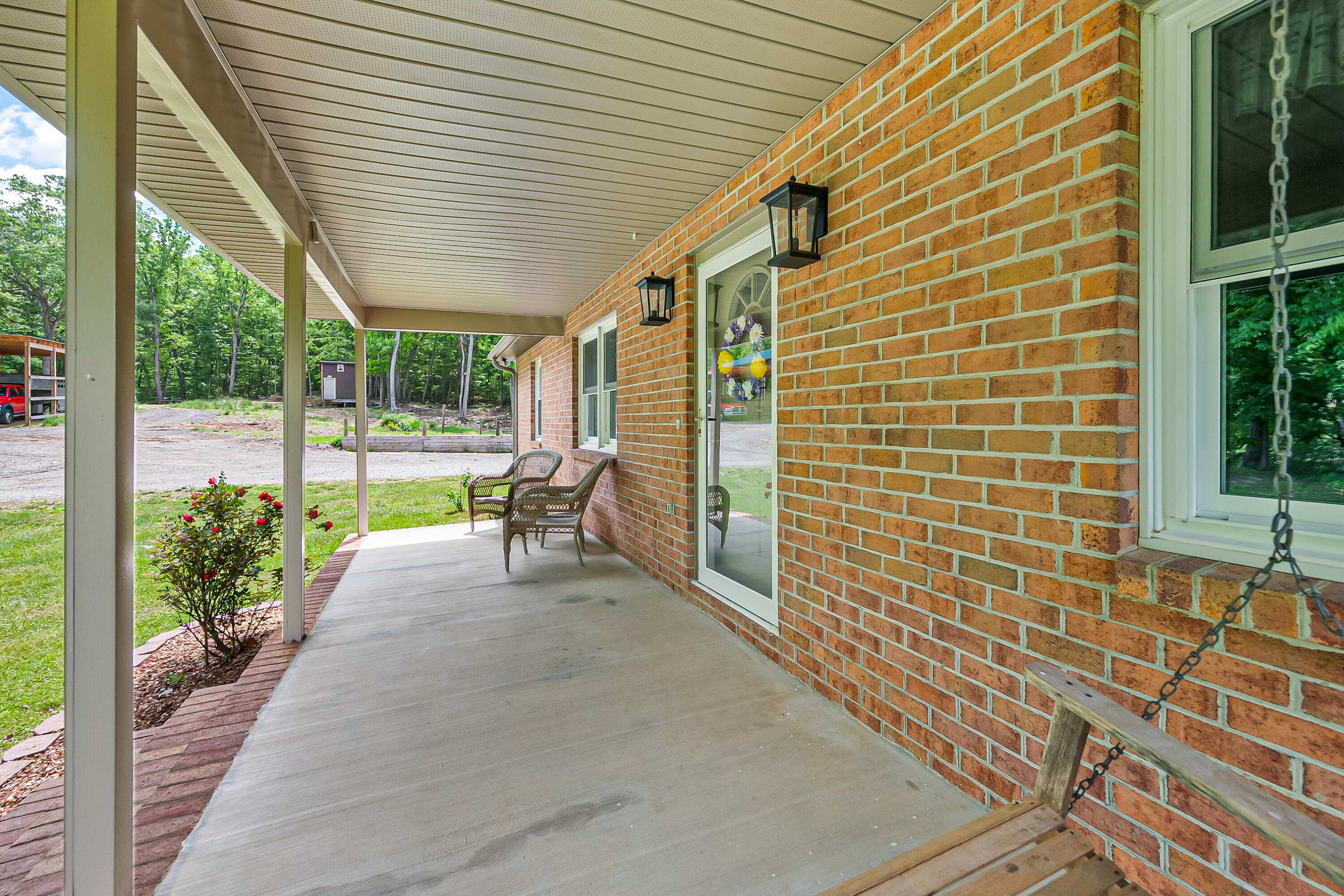 1365 Brake Road Elliston, VA 24087 - Photo 9 of 98 a view of a patio with table and chairs and potted plants