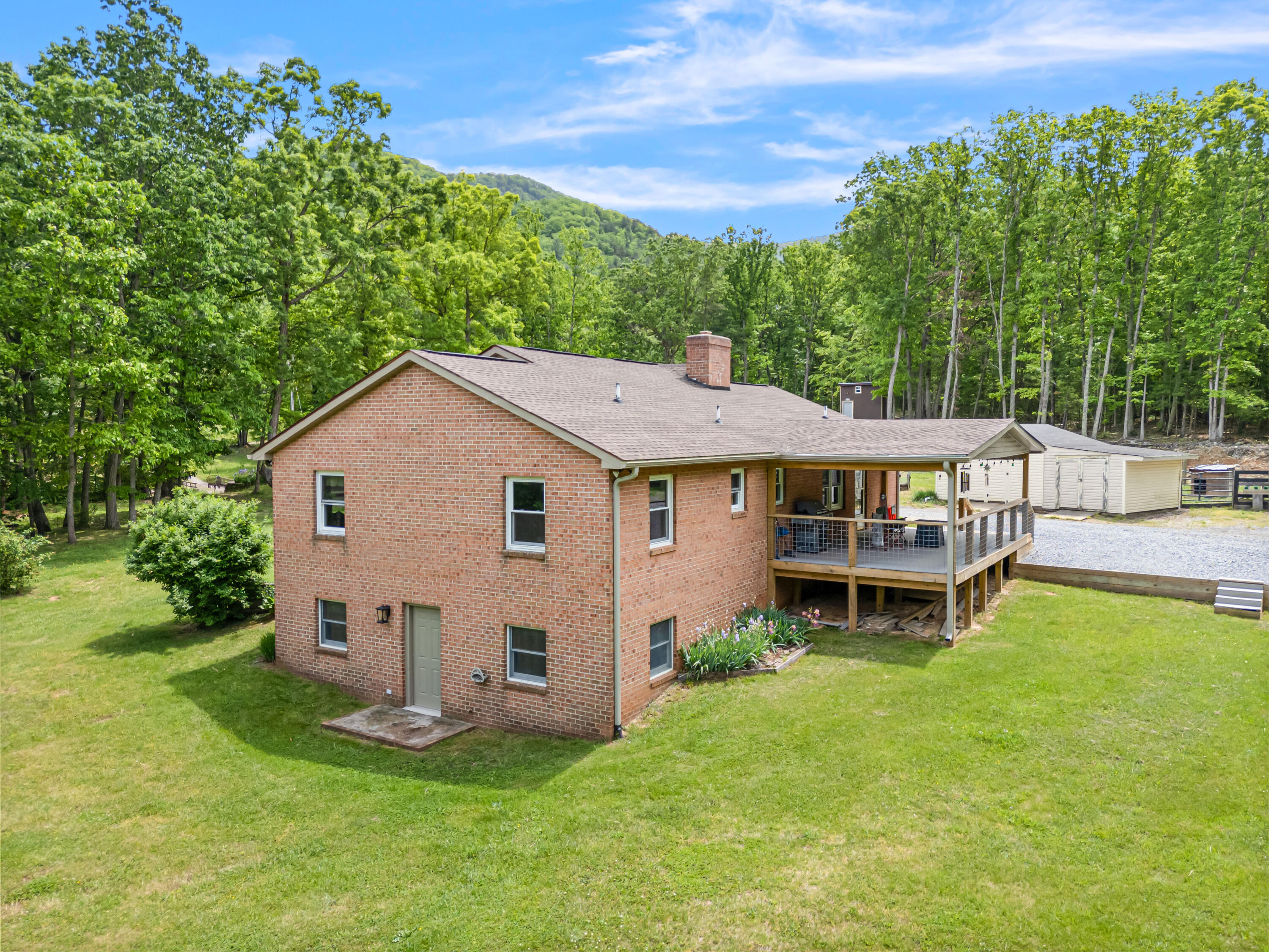 1365 Brake Road Elliston, VA 24087 - Photo 89 of 98 a view of a house with a yard porch and sitting area