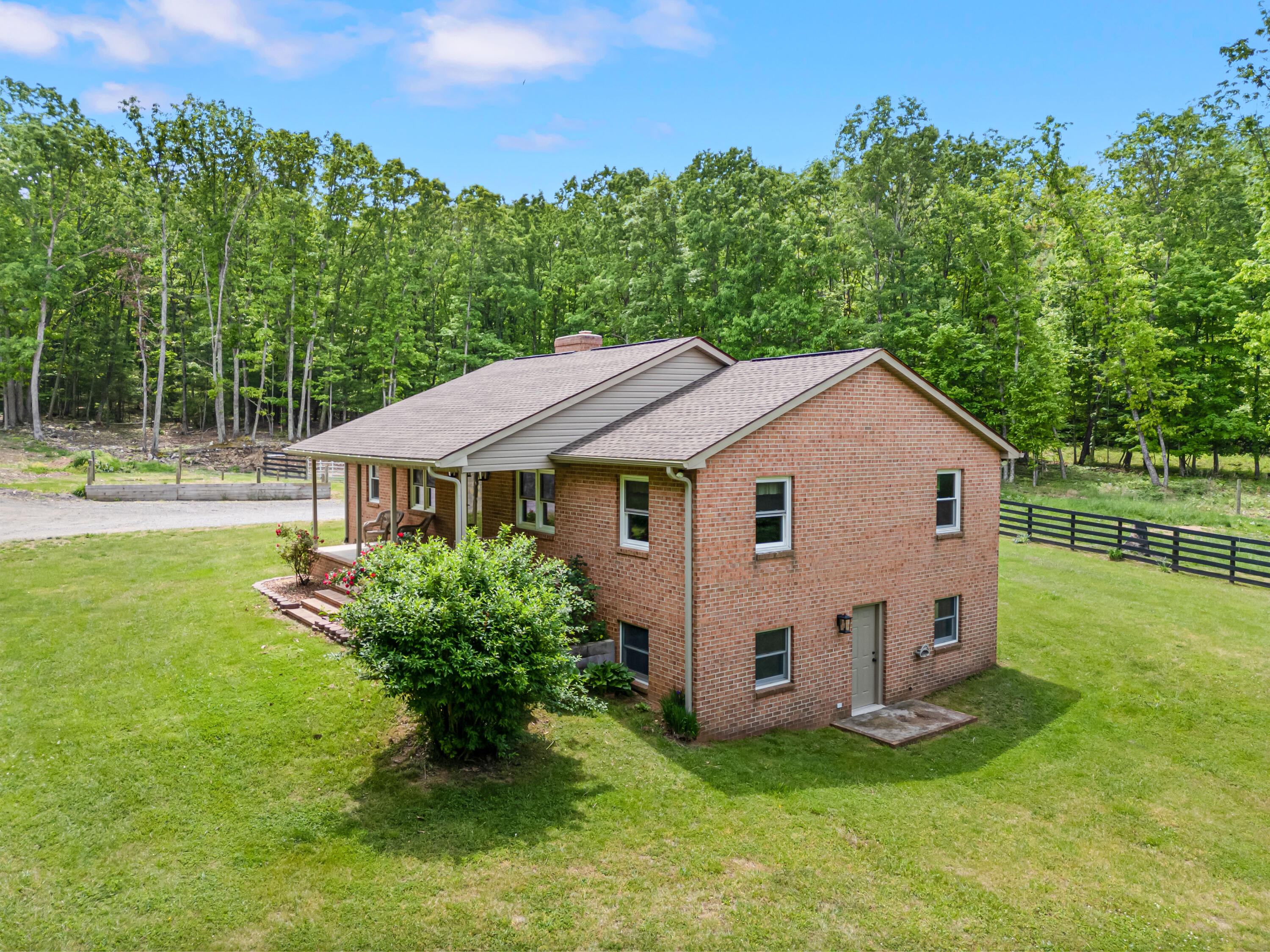 1365 Brake Road Elliston, VA 24087 - Photo 90 of 98 a view of a house with a yard and sitting area