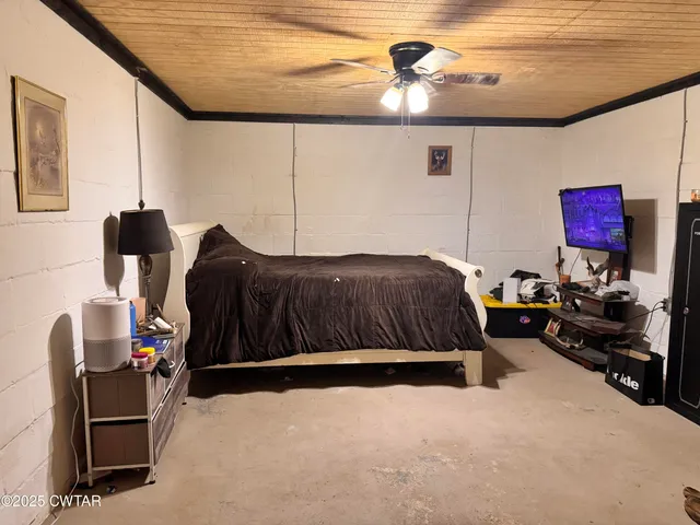 a view of a field with large trees