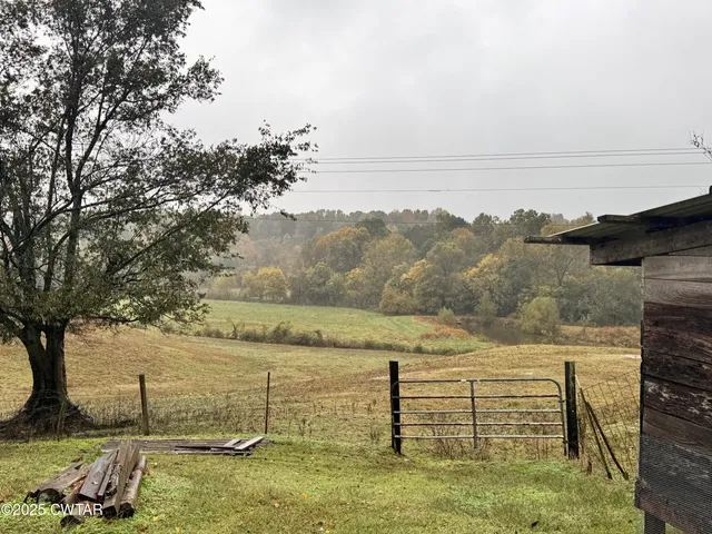 a view of a house with wooden deck