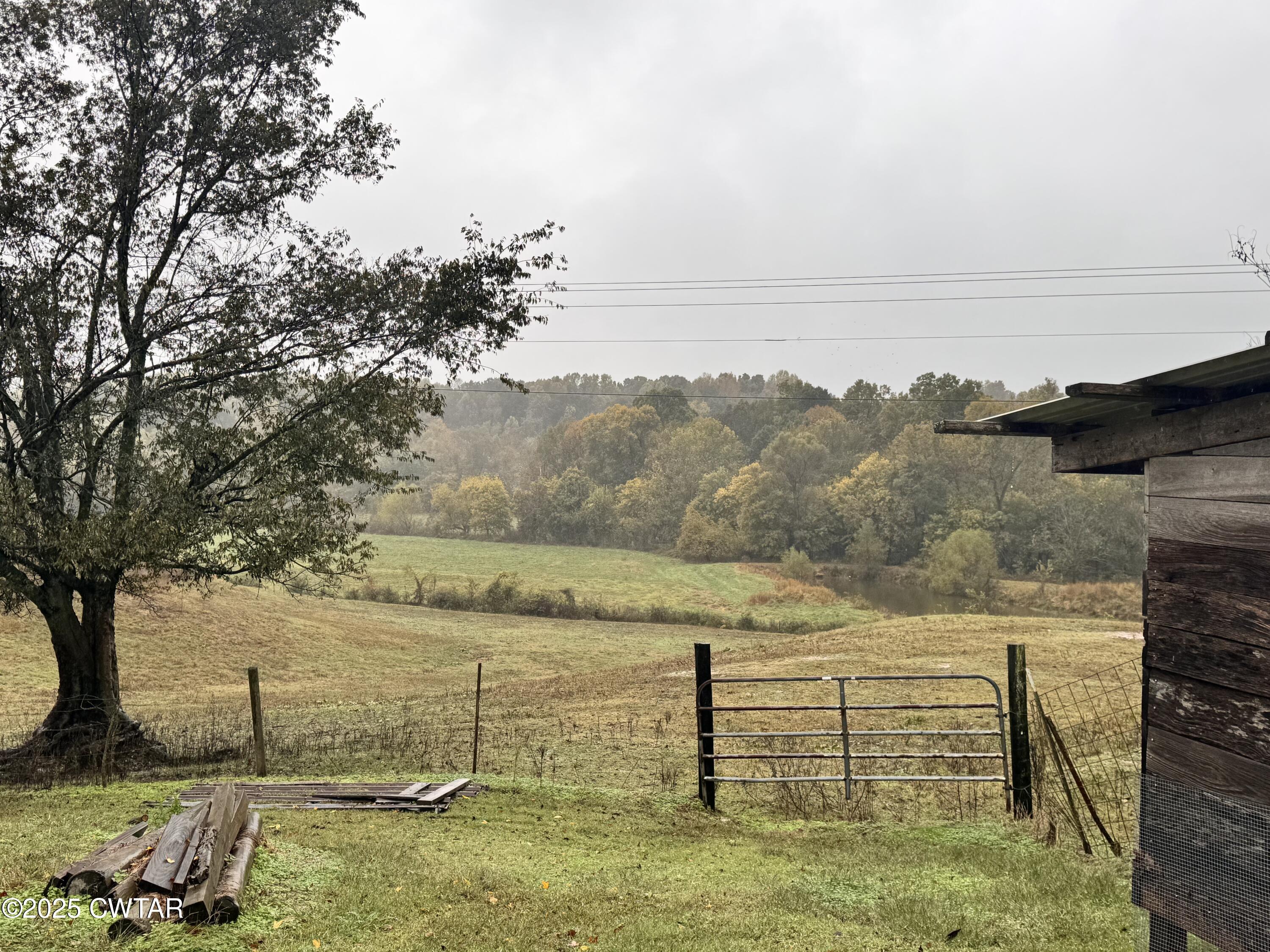2727 Marvin Vaught Road Troy, TN 38260 - Photo 16 of 19 a view of a lake from a yard