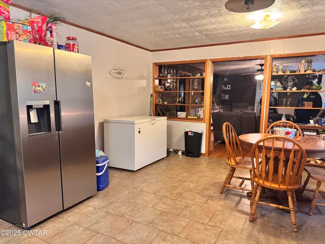 a bedroom with a bed and a table