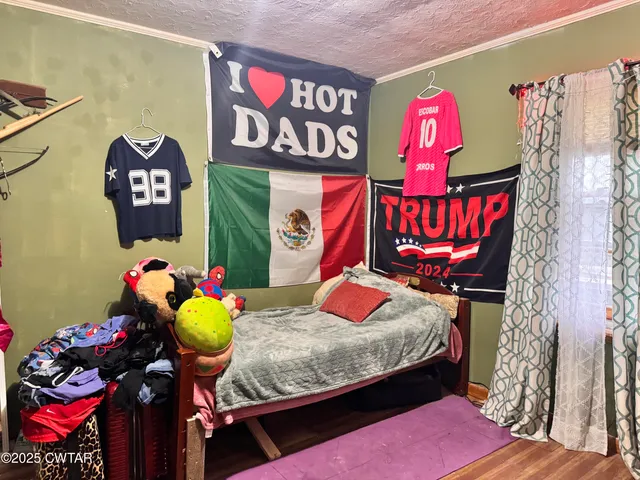 a bathroom with a sink a toilet and shower curtain
