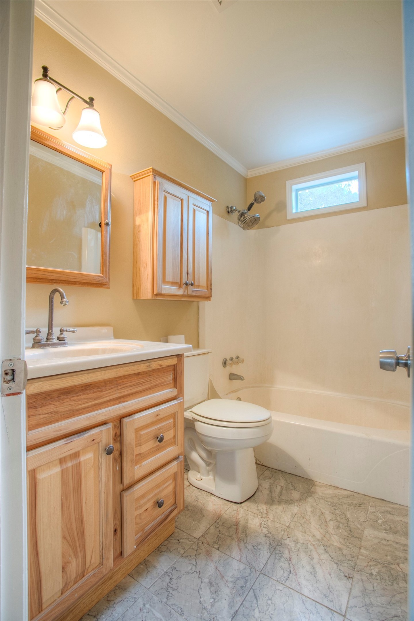 81 Westlake Road Trinity, TX 75862 - Photo 13 of 23 a bathroom with a toilet a sink a mirror a bathtub and vanity