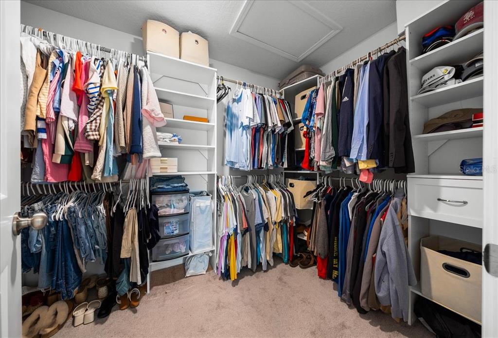 9329 Southwest 57th Terrace Ocala, FL 34476 - Photo 28 of 64 a view of walk in closet with clothes