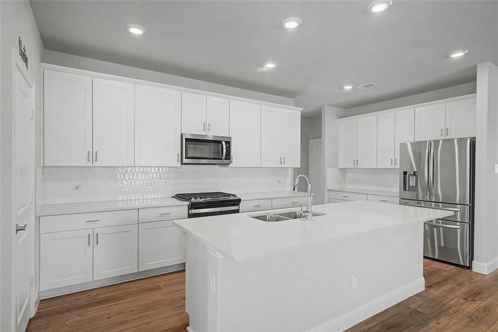 2344 Bellatrix Drive Haslet, TX 76052 - Photo 10 of 39 CHEF'S DELIGHT WITH GAS RANGE AND FRENCH STYLE REFRIGERATOR