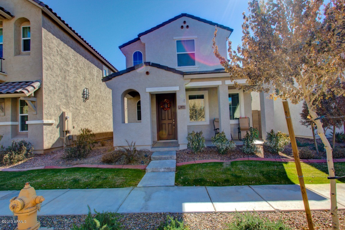 4073 East Tulsa Street Gilbert, AZ 85295 - Photo 1 of 33 a front view of a house with garden