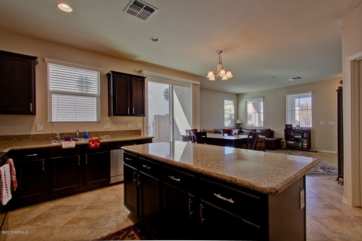 4073 East Tulsa Street Gilbert, AZ 85295 - Photo 13 of 33 a kitchen with a stove and a sink