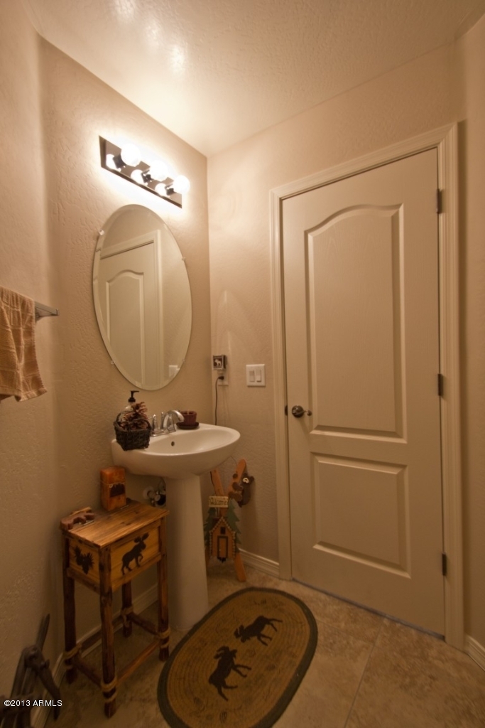 4073 East Tulsa Street Gilbert, AZ 85295 - Photo 14 of 33 a bathroom with a sink and a mirror