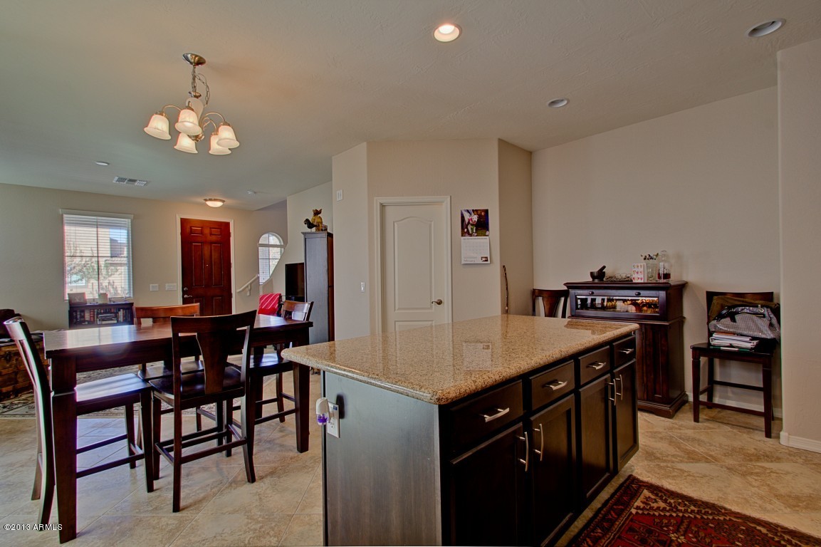 4073 East Tulsa Street Gilbert, AZ 85295 - Photo 15 of 33 a kitchen with a dining table and chairs