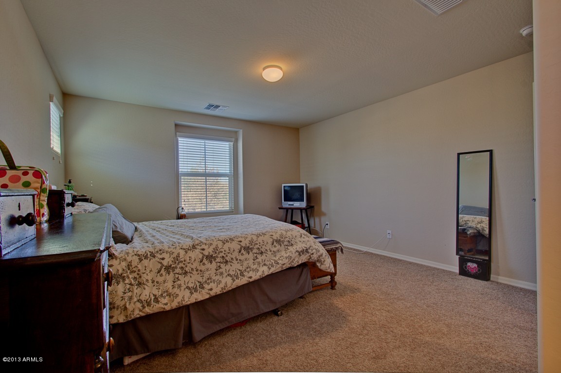 4073 East Tulsa Street Gilbert, AZ 85295 - Photo 18 of 33 a bedroom with a bed and a desk