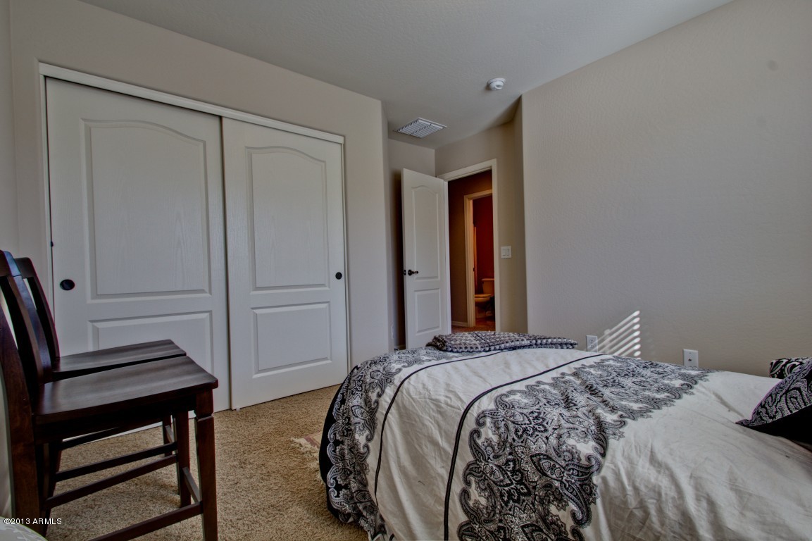 4073 East Tulsa Street Gilbert, AZ 85295 - Photo 27 of 33 a bedroom with a bed and a dresser
