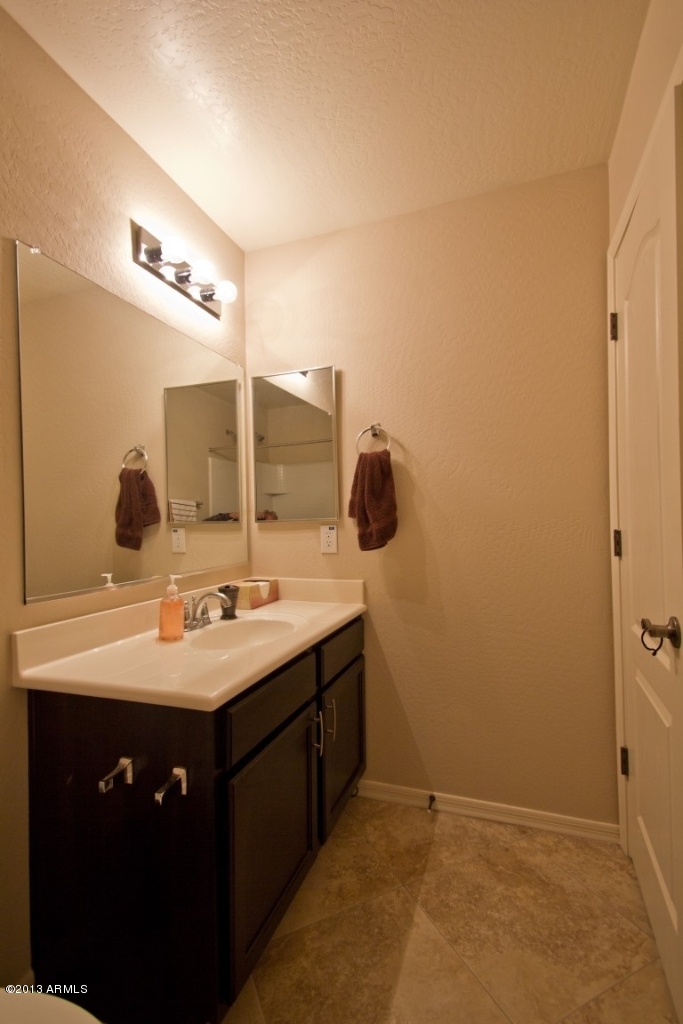 4073 East Tulsa Street Gilbert, AZ 85295 - Photo 29 of 33 a bathroom with a sink and a mirror