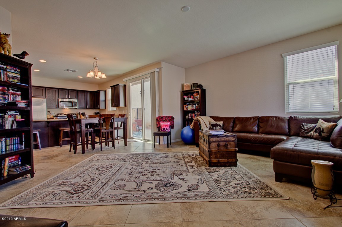 4073 East Tulsa Street Gilbert, AZ 85295 - Photo 4 of 33 a living room with furniture and a dining table