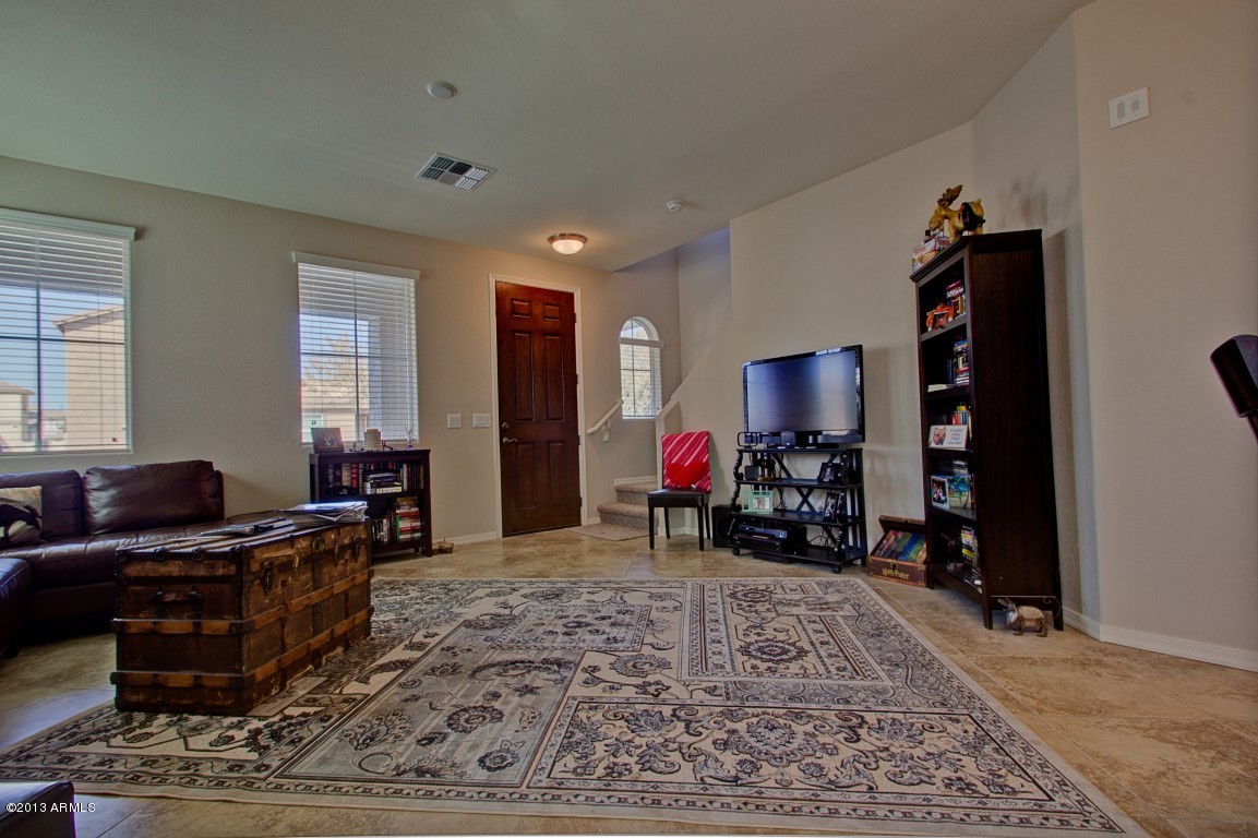 4073 East Tulsa Street Gilbert, AZ 85295 - Photo 6 of 33 a living room with furniture and a flat screen tv