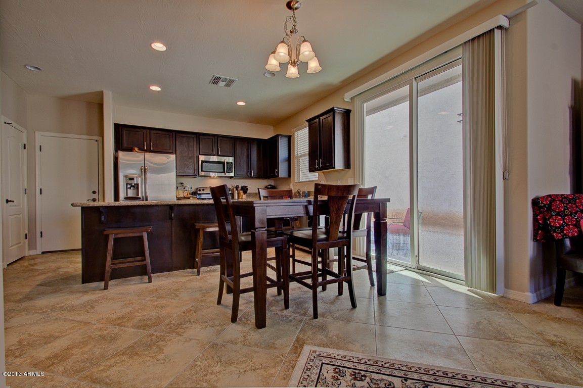 4073 East Tulsa Street Gilbert, AZ 85295 - Photo 7 of 33 a view of a dining room with furniture
