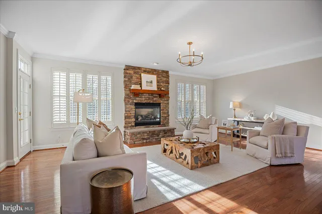 a view of an empty room with a window and a ceiling fan