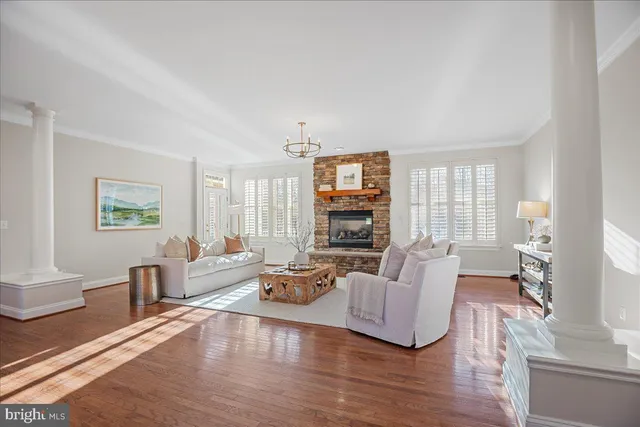 an empty room with windows and mirror