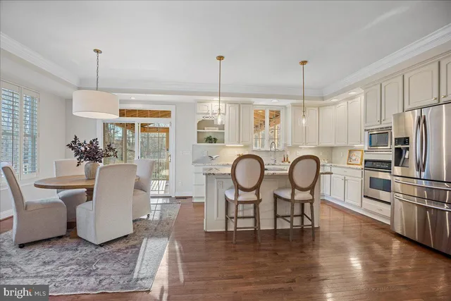 a front view of a house with a garden and plants