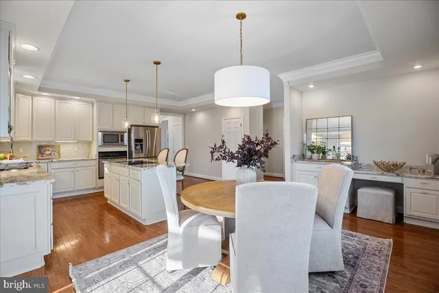 a view of backyard with swimming pool and green space