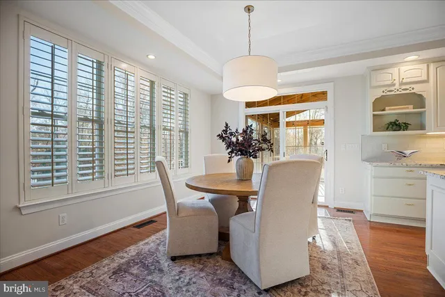 a view of a patio with a table and chairs