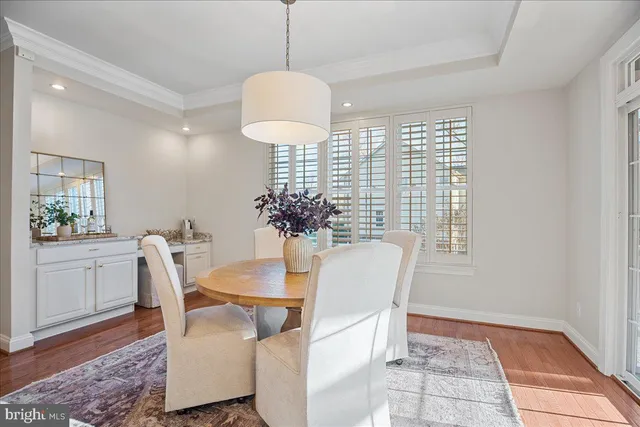 a view of a patio with a table and chairs
