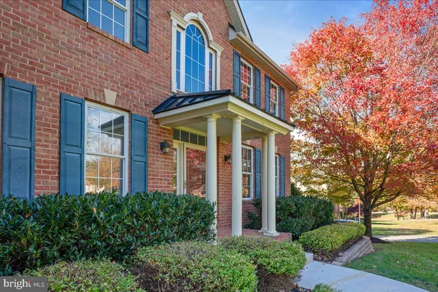 a dining room with furniture a rug and a chandelier