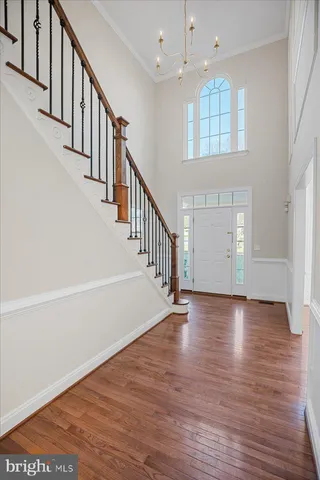 a view of a room with a table and chairs