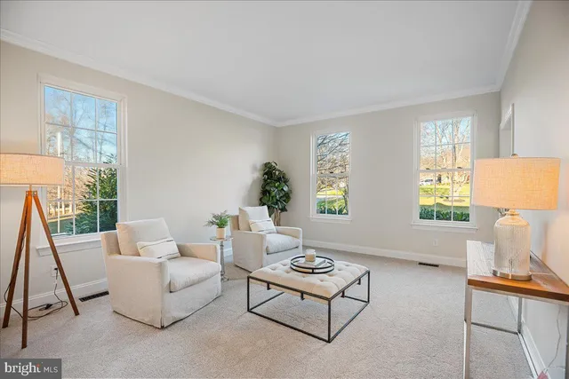 a living room with fireplace furniture and a wooden floor