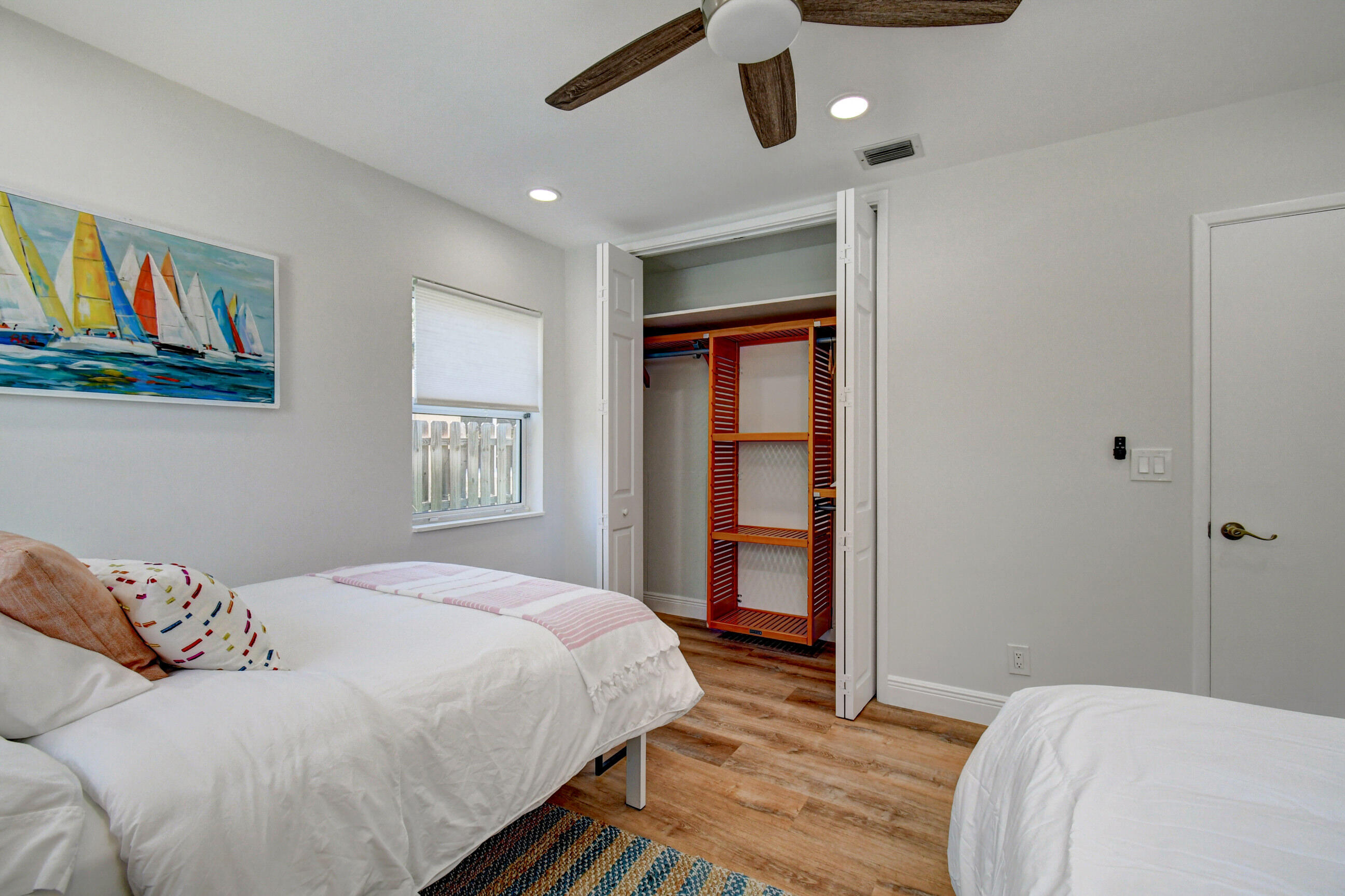 309 Rilyn Drive West Palm Beach, FL 33405 - Photo 11 of 26 a bedroom with a bed and a large window