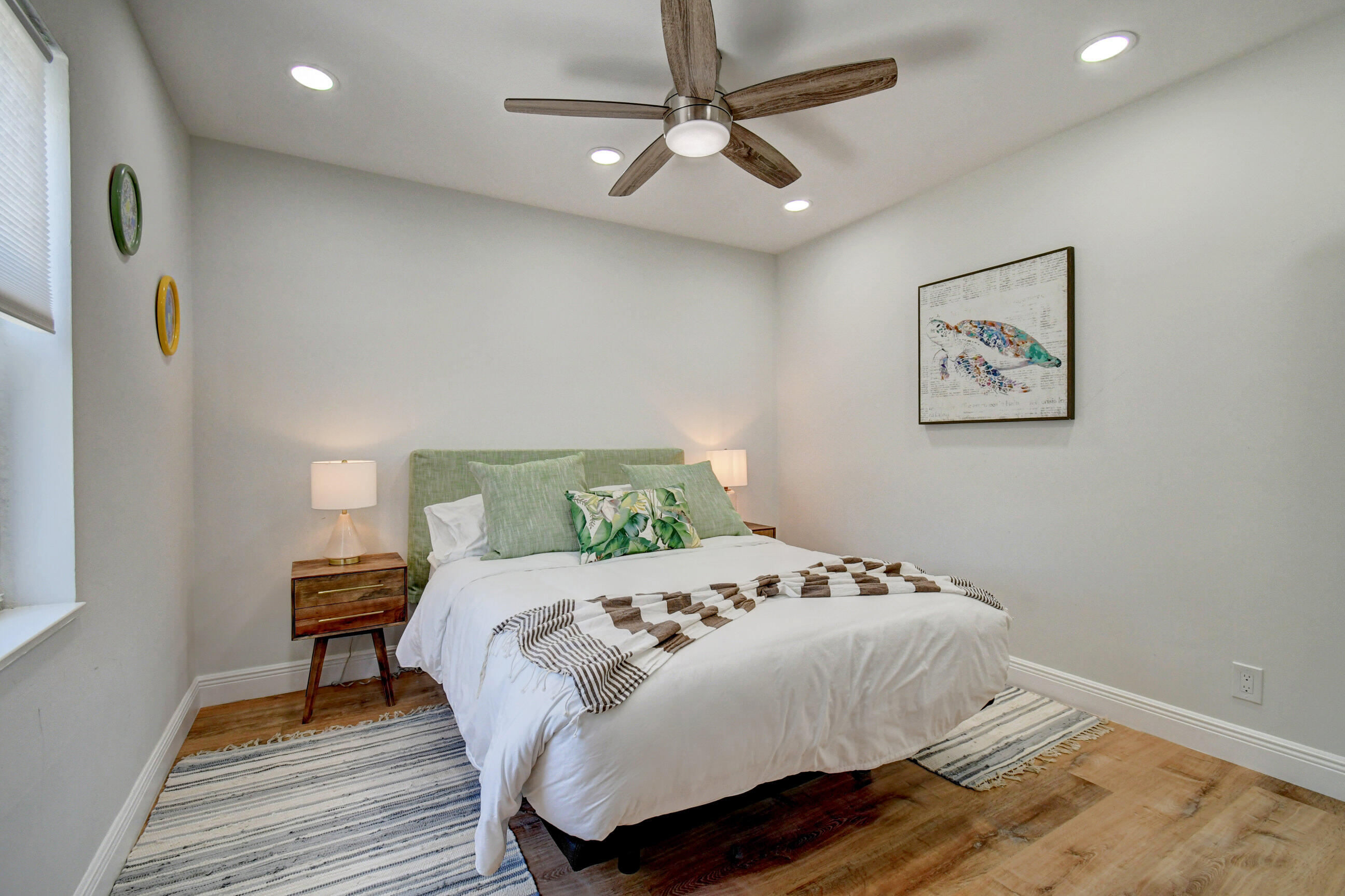 309 Rilyn Drive West Palm Beach, FL 33405 - Photo 12 of 26 a bedroom with a bed and wooden floor