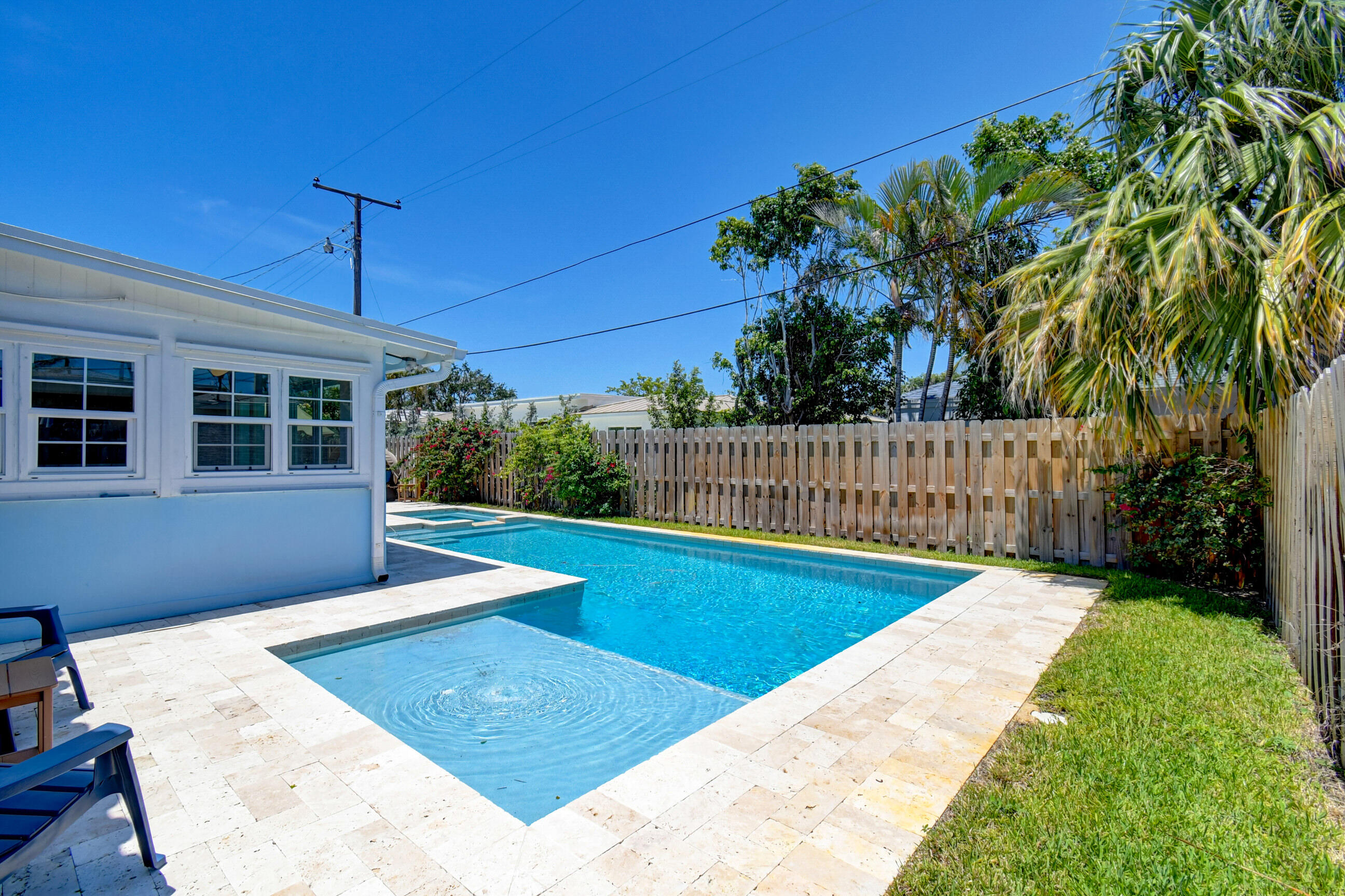 309 Rilyn Drive West Palm Beach, FL 33405 - Photo 20 of 26 a view of a backyard with a small pool