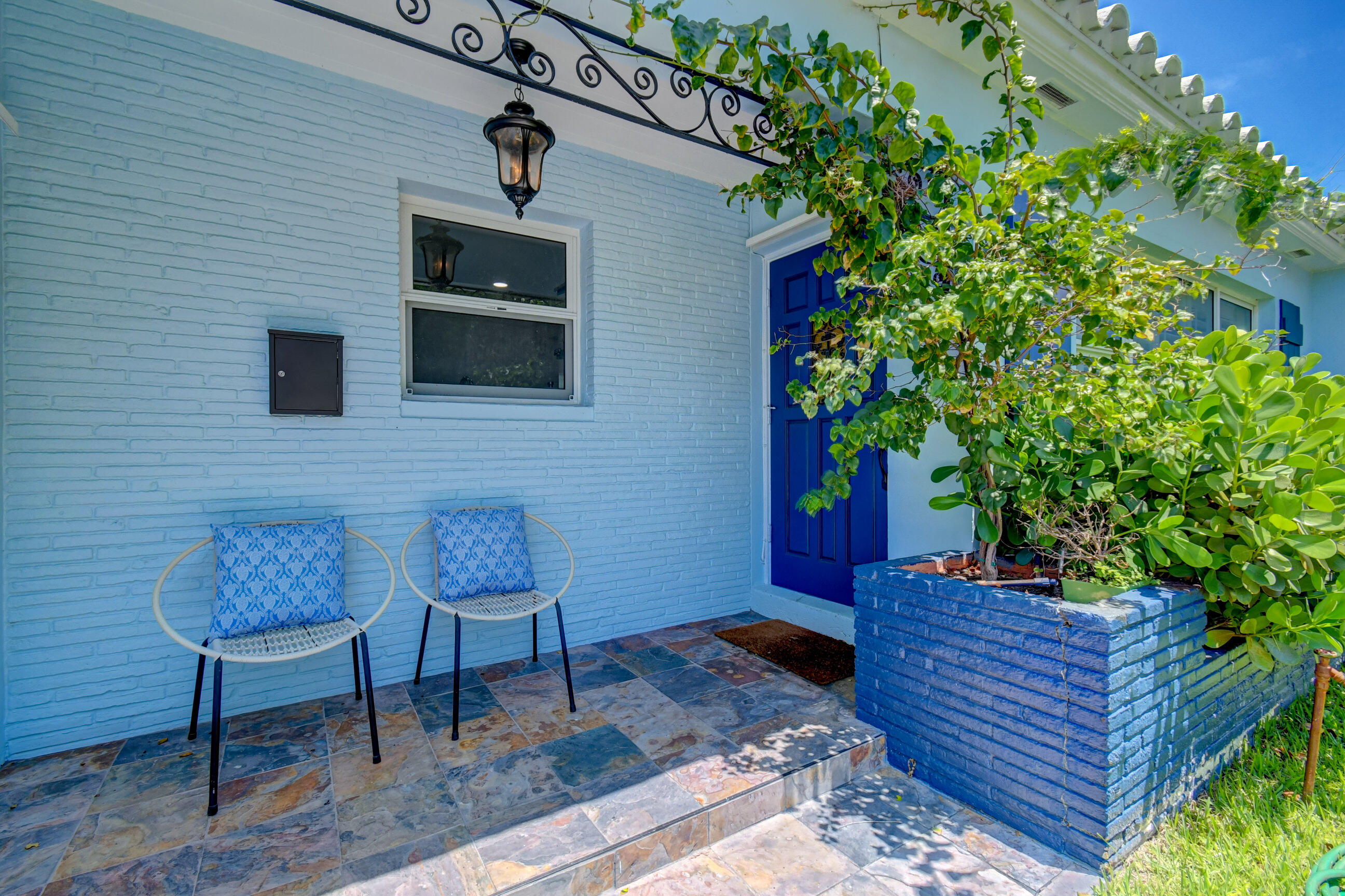 309 Rilyn Drive West Palm Beach, FL 33405 - Photo 25 of 26 a front view of a house with outdoor seating