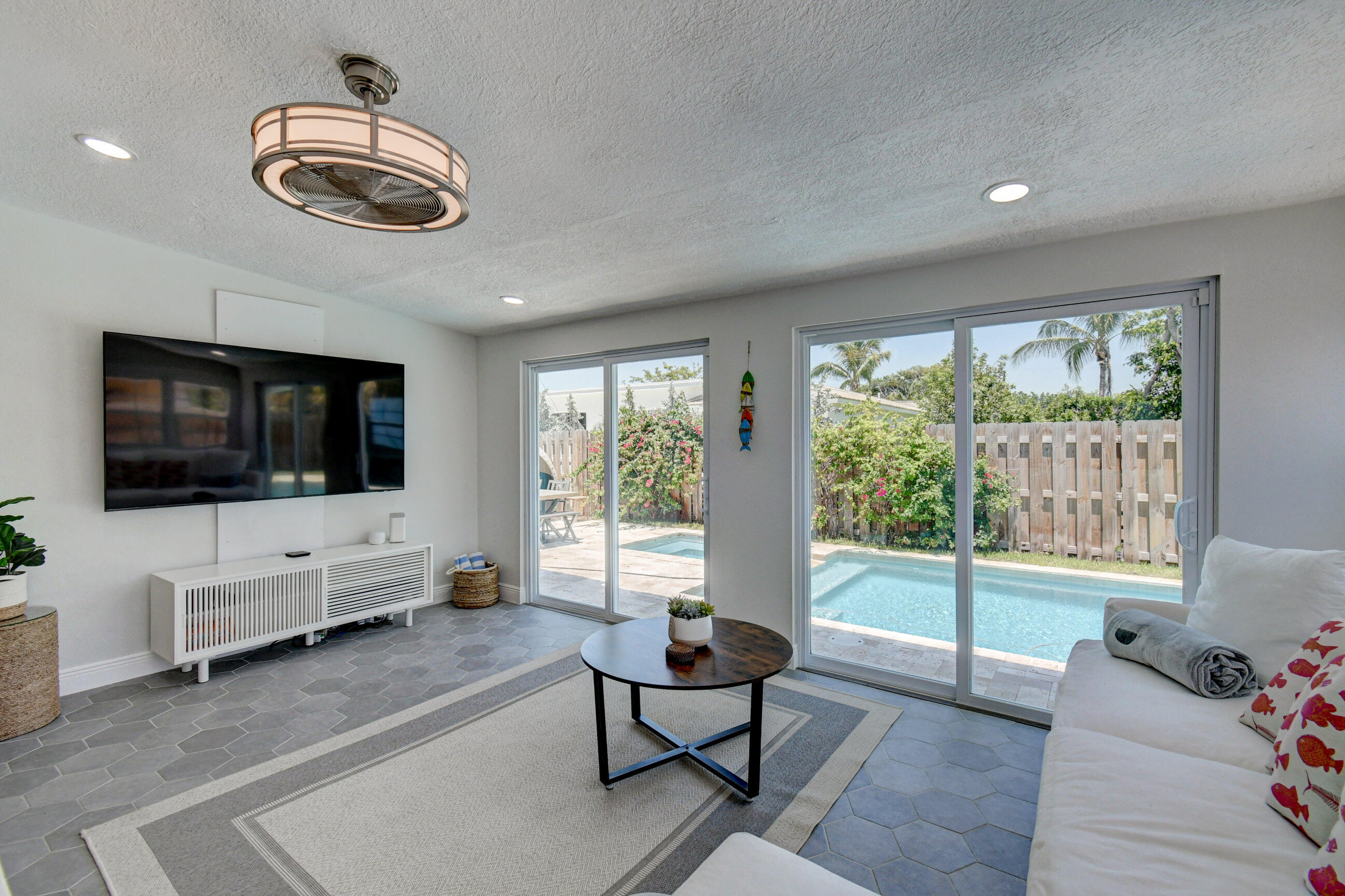 309 Rilyn Drive West Palm Beach, FL 33405 - Photo 8 of 26 a living room with furniture and a flat screen tv