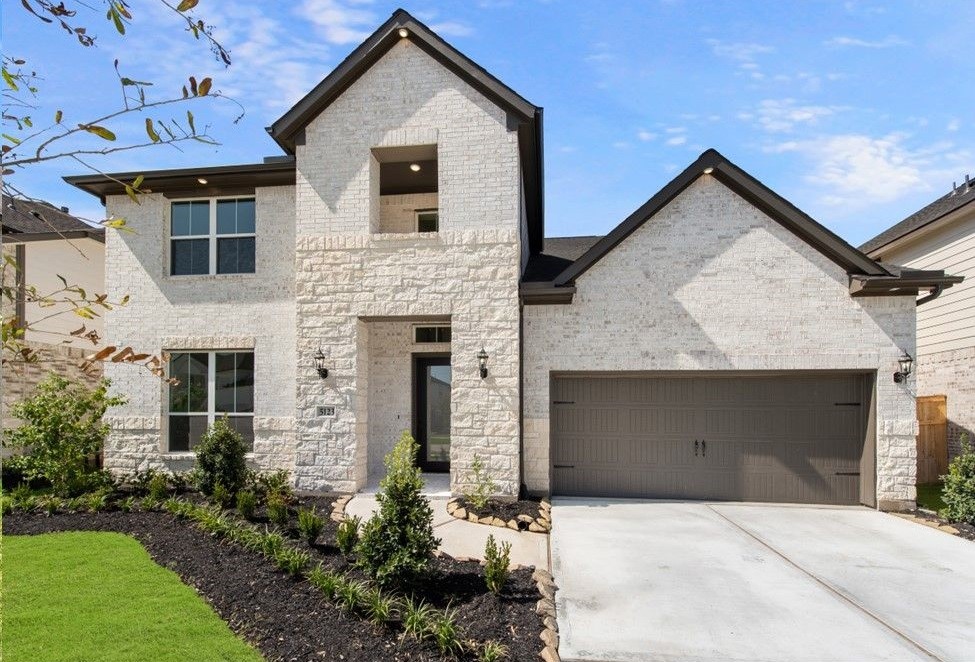 1301 Rodeo Ridge Drive Georgetown, TX 78628 - Photo 1 of 1 a front view of a house with a yard and garage