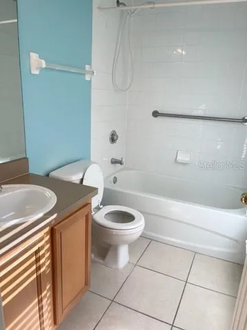 a bathroom with a sink a toilet and bathtub