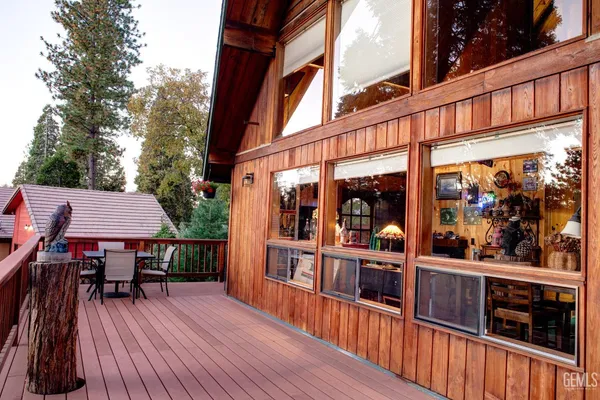 a view of balcony with deck and wooden floor