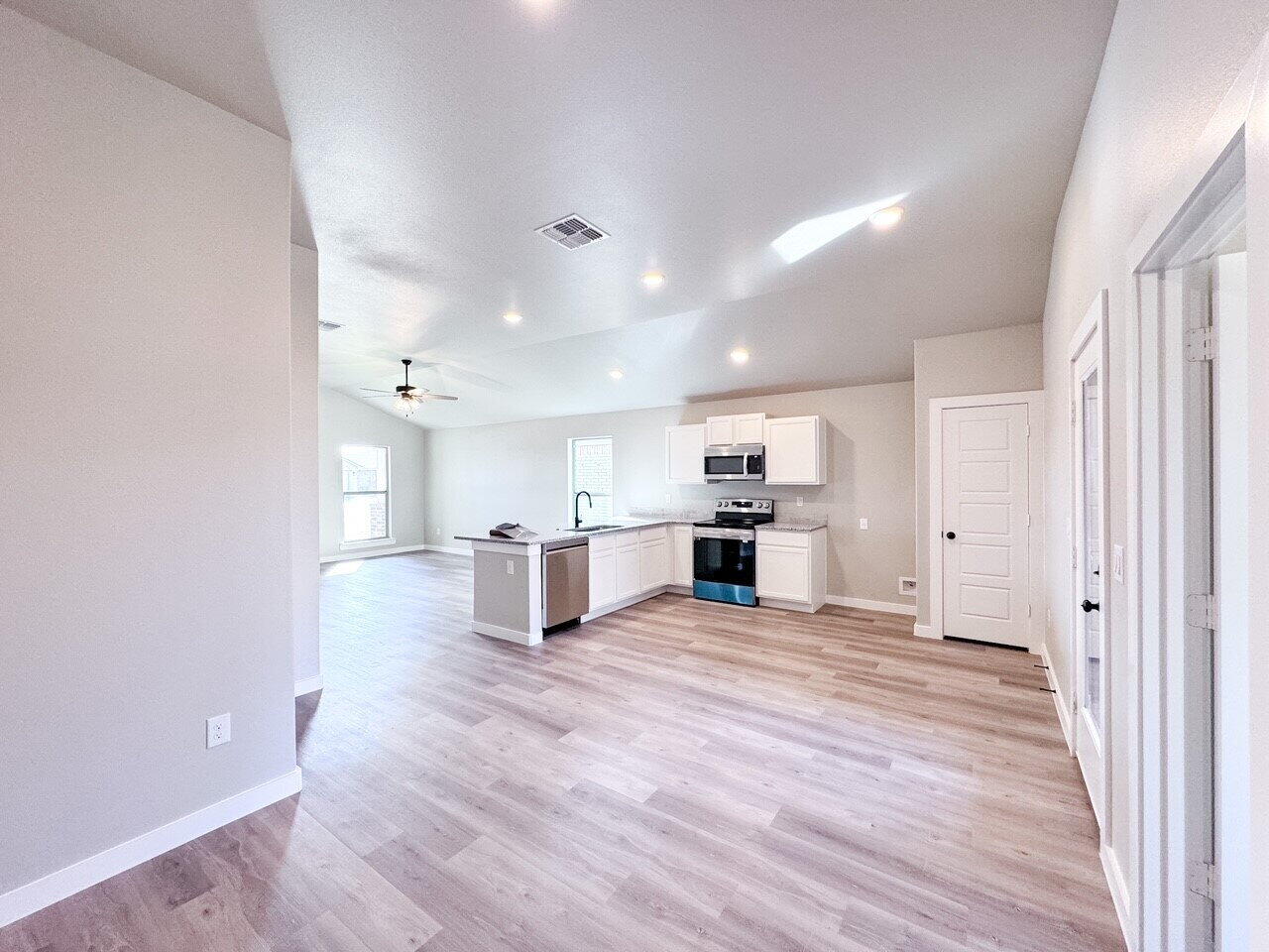 6928 10th Street Lubbock, TX 79416 - Photo 12 of 23 a view of kitchen with wooden floor