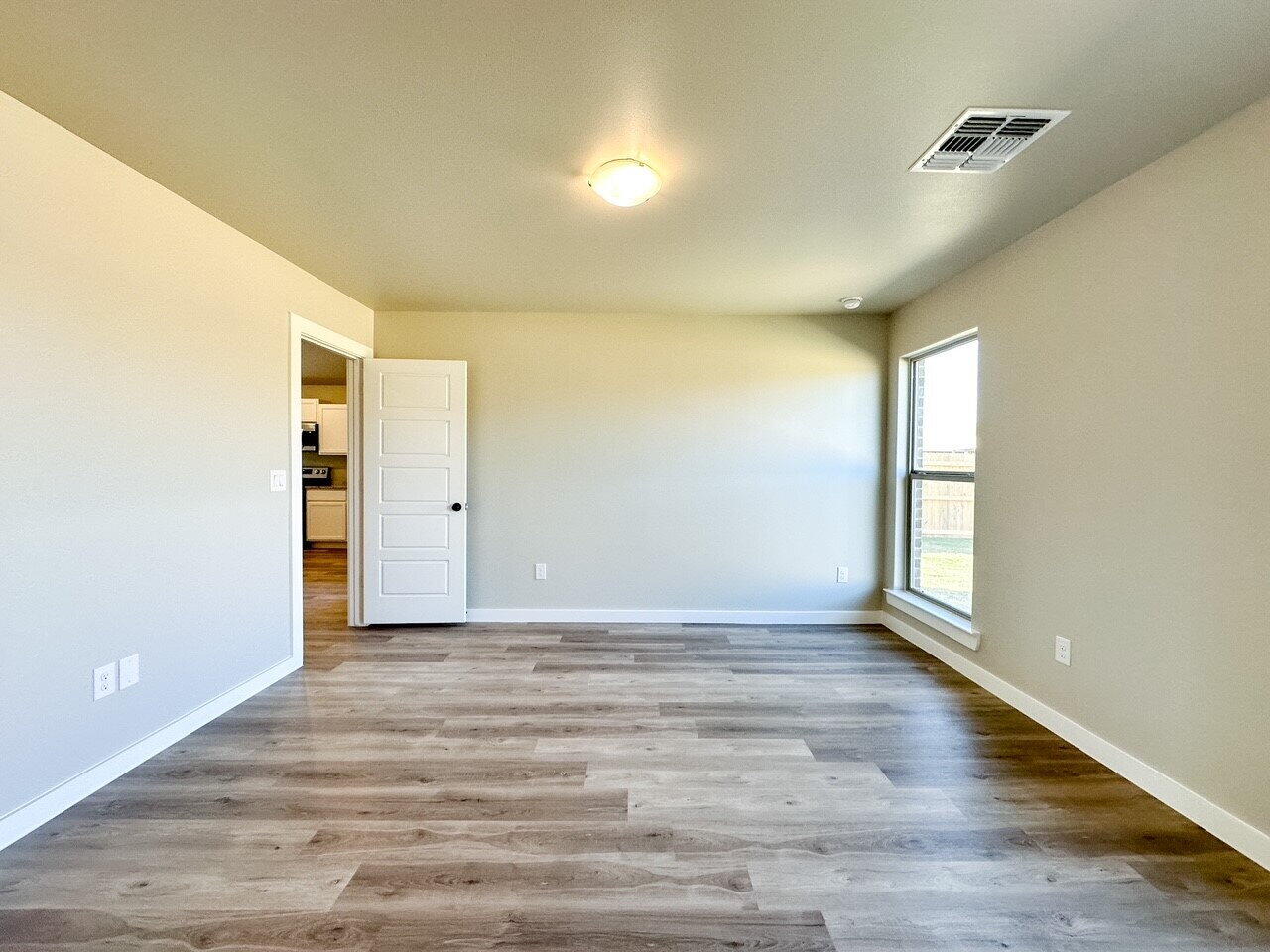 6928 10th Street Lubbock, TX 79416 - Photo 17 of 23 a view of an empty room and window