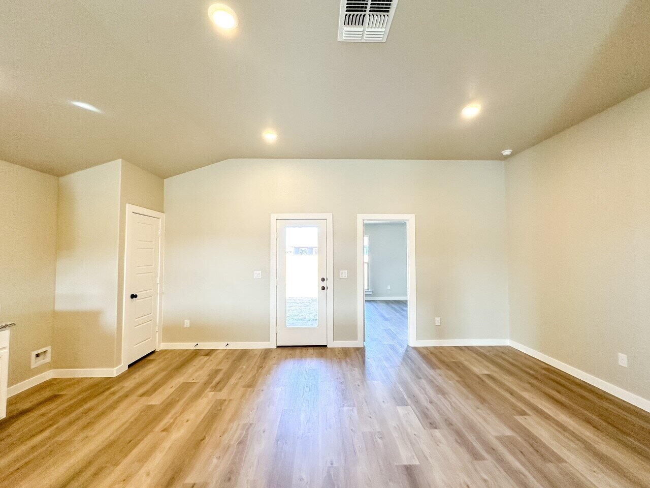 6928 10th Street Lubbock, TX 79416 - Photo 9 of 23 a view of a room with wooden floor and natural light