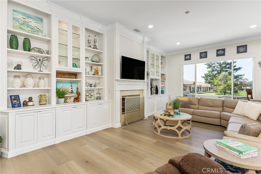 5233 Hampton Road Banning, CA 92220 - Photo 11 of 46 a living room with furniture a fireplace and a flat screen tv