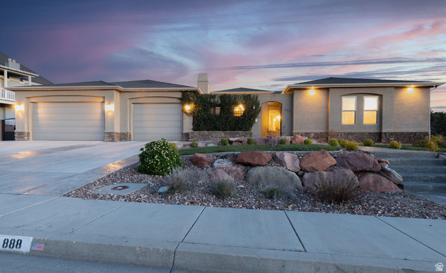 888 East Fiddlers Canyon Road Cedar City, UT 84721 - Photo 64 of 74 Prairie-style home featuring stone siding, an attached garage, driveway, and stucco siding