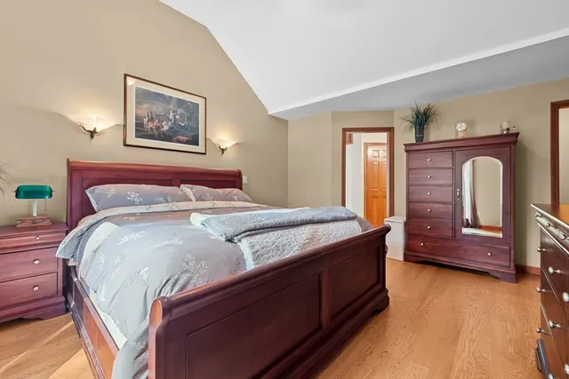 a bedroom with a bed and a dresser