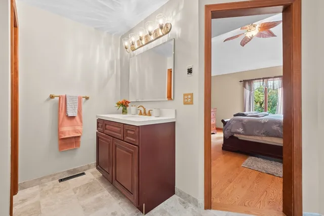 a en suite bathroom with a sink and a mirror