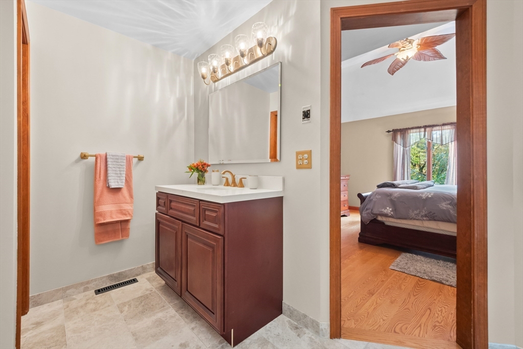 45 North Farms Road Williamsburg, MA 01039 - Photo 22 of 41 a en suite bathroom with a sink and a mirror