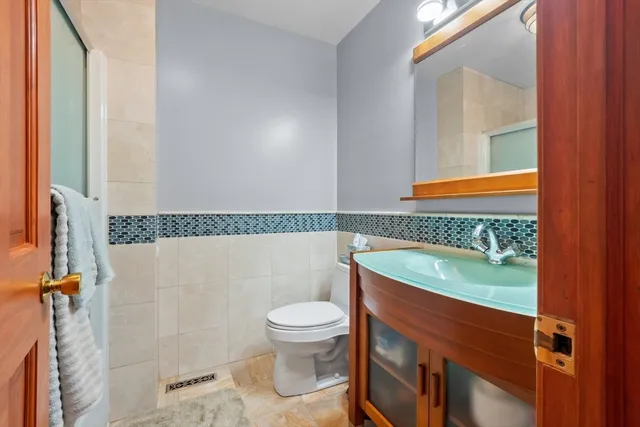 a bathroom with a sink a toilet and a bathtub