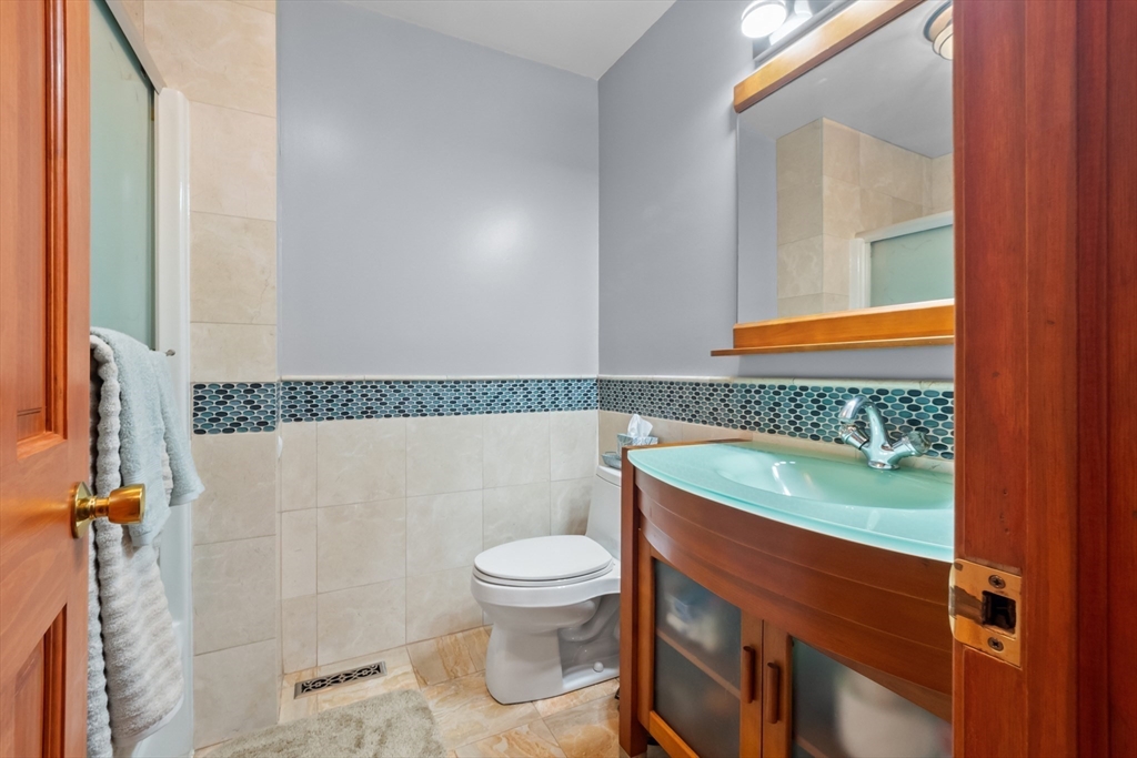 45 North Farms Road Williamsburg, MA 01039 - Photo 27 of 41 a bathroom with a sink a toilet and a bathtub