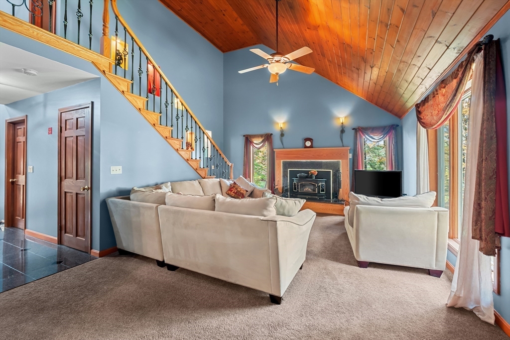 45 North Farms Road Williamsburg, MA 01039 - Photo 6 of 41 a living room with fireplace furniture and a window