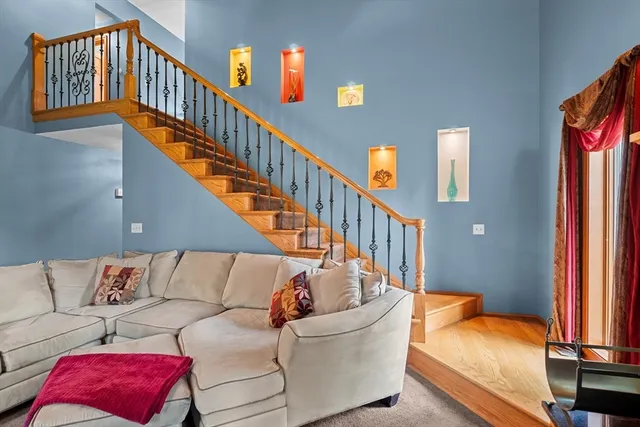 a living room with furniture or stairs and a couch